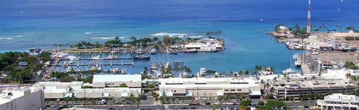 Sunrise at Kewalo Basin Harbor with Rainbow Scuba Hawaii’s Hookup boat ready to depart